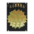 Black panel with gold geometric shape, five jack sockets, two knobs, and three lit amber LEDs.