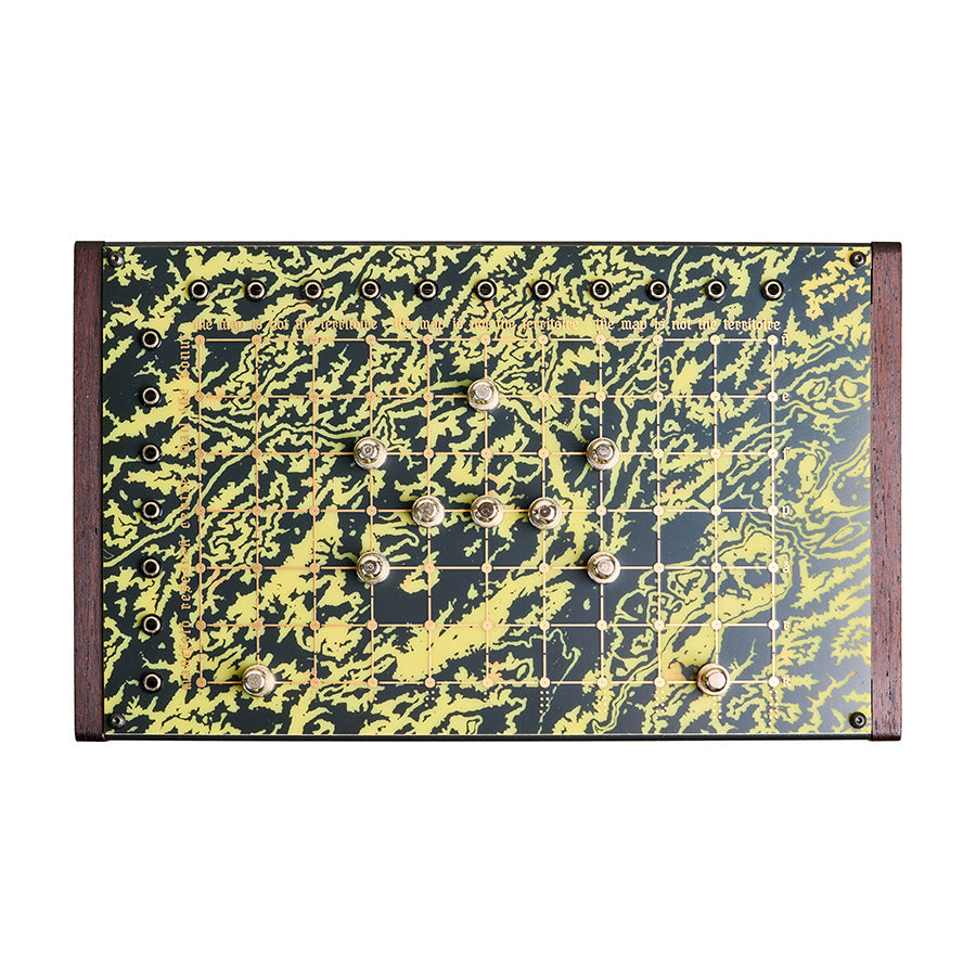 Top view of an electronic device with multiple 1/4 inch jacks and rotary knobs on a patterned panel with text.
