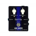Black rectangular audio switching pedal with two white rotary knobs, one footswitch, and multiple 1/4 inch jacks.