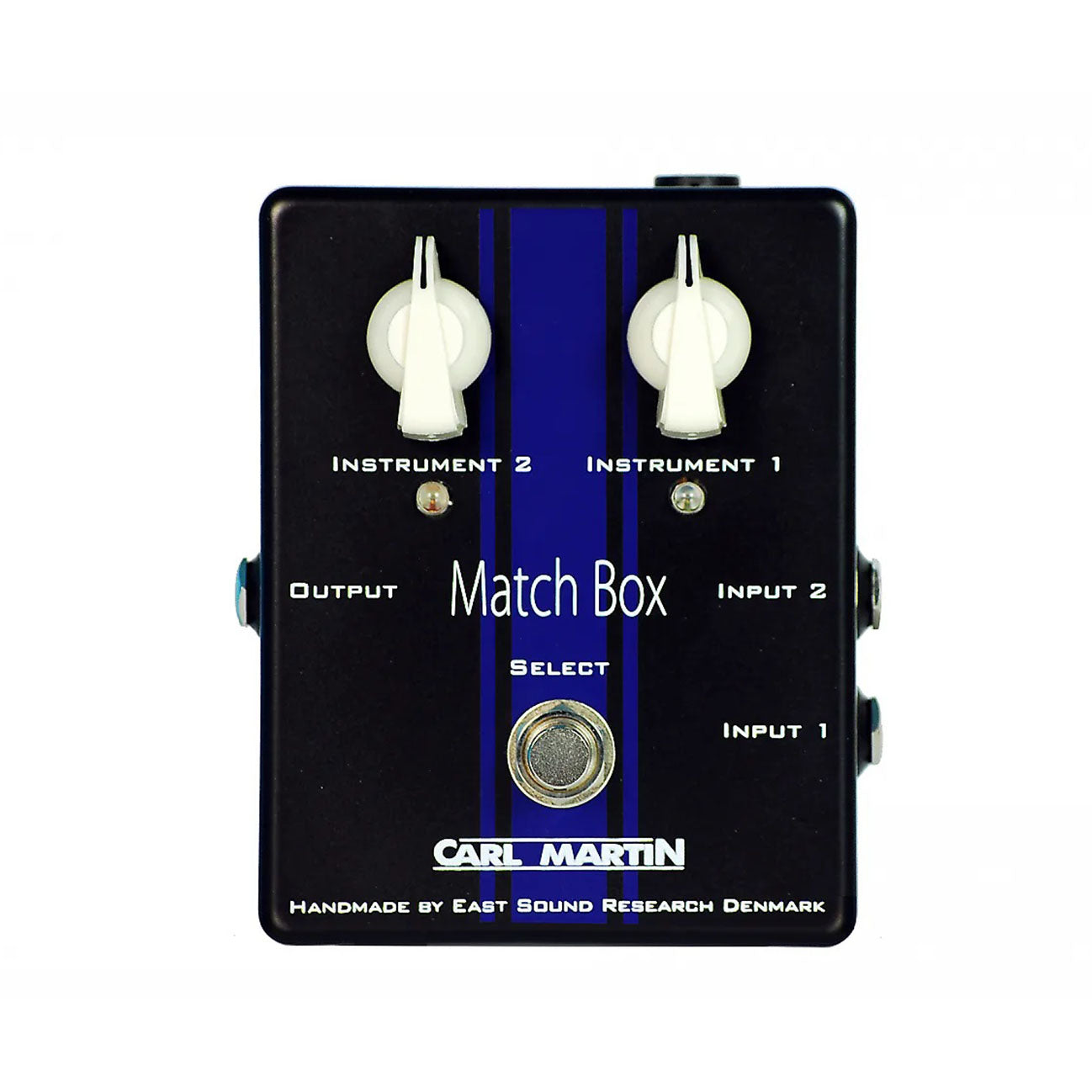 Black rectangular audio switching pedal with two white rotary knobs, one footswitch, and multiple 1/4 inch jacks.