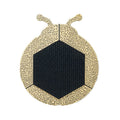 Hexagonal black fabric area surrounded by beige wooden frame shaped like a stylized insect.