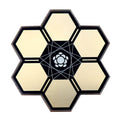 Hexagonal device with six segments and a central flower-like pattern and metal contact points on some edges.