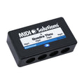 Black MIDI Solutions Quadra Thru interface box showing four 5-pin DIN female ports on one side.