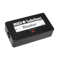 Black rectangular MIDI device with one visible round 5-pin DIN input socket and labeled outputs