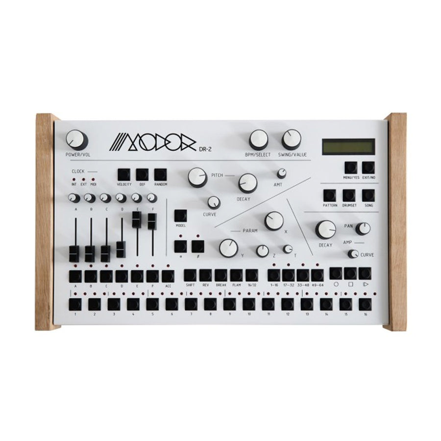 Top view of a Modor DR-2 drum machine with wooden sides, multiple knobs, sliders, buttons, and a small screen.
