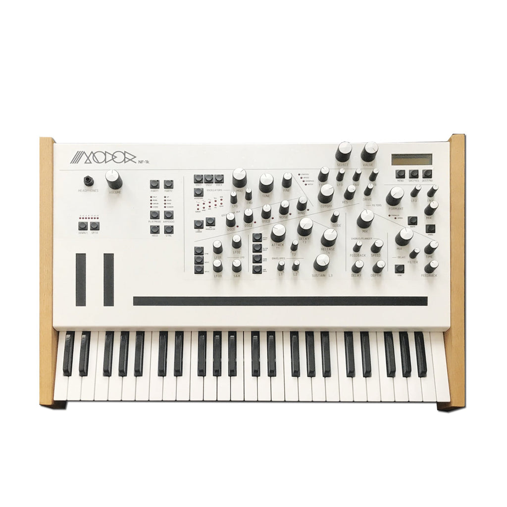 White keyboard synthesizer with wooden side panels and multiple knobs, buttons, and a small display on the top panel.