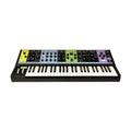 Black keyboard synthesizer with multiple control sections in yellow, blue, green, and purple panels above the keys.