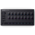 Black MIDI controller with 16 rotary knobs, buttons, and multi-colored LED indicators on a flat surface.