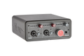 Black audio interface box with dual combo XLR/TRS inputs, gain knobs, and monitor level controls.