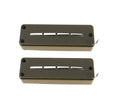 Two black rectangular soapbar style pickups with four silver pole pieces and wire leads on white background.