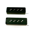 Two black rectangular soapbar-style pickups with visible pole pieces and attached twisted wires.
