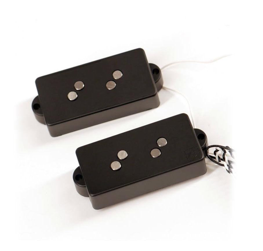Two black rectangular guitar pickups with four round metal pole pieces each and attached wires on a white background.