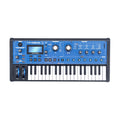 Blue and black synthesizer keyboard with display, knobs, buttons, and eight pads on white background.