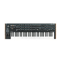 Black synthesizer keyboard with knobs, buttons, sliders, and wood side panels laid flat on white background.