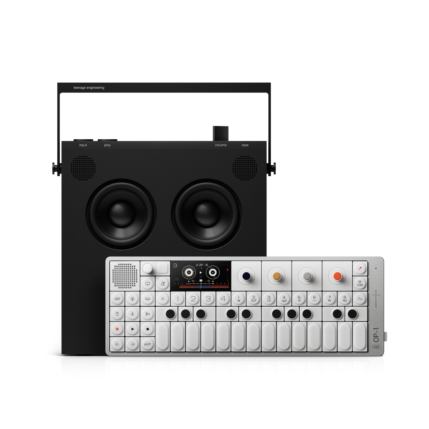 Black portable speaker with handle behind a compact white synthesizer keyboard with buttons and small display