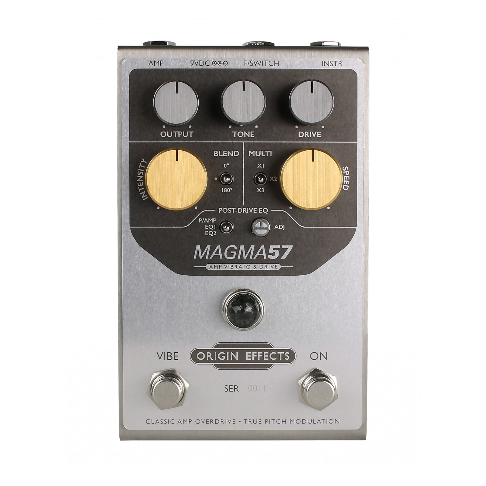 Silver guitar effects pedal with black and gold knobs labeled MAGMA57 by Origin Effects.