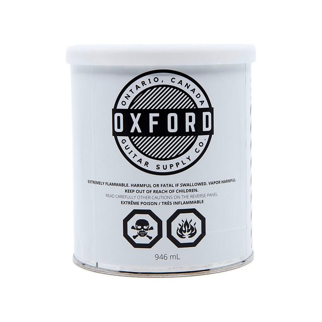 White tin can labeled Oxford Guitar Supply Co. containing 946 mL of flammable liquid lacquer.
