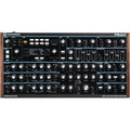Front view of a Novation PEAK synthesizer with multiple knobs, buttons, and an LCD screen.