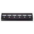 Black pedalboard with six labeled footswitches numbered 1 to 6 and colored LEDs on switches 4, 5, and 6.