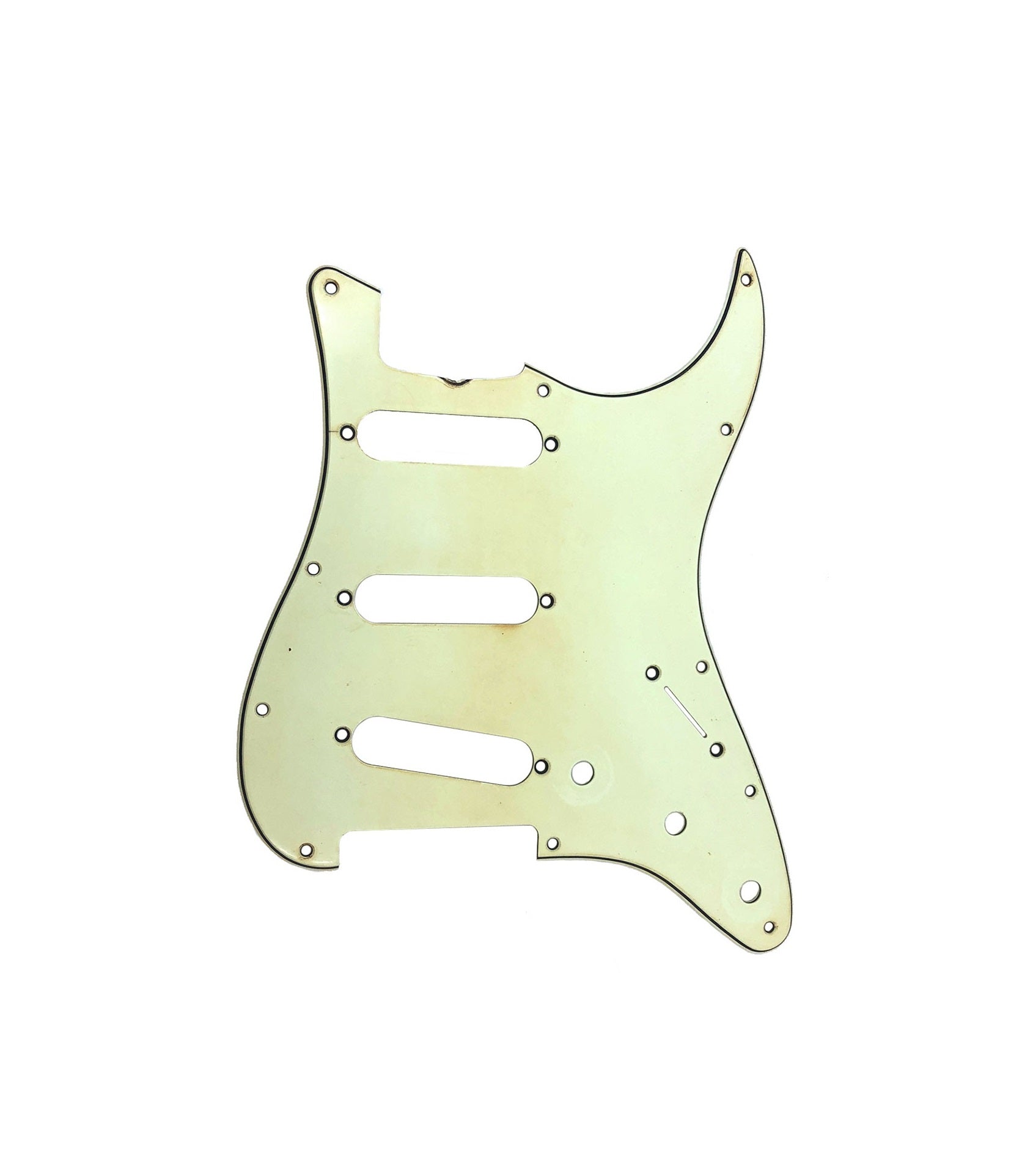 A worn pale yellow guitar pickguard with three pickup slots and 11 screw holes.