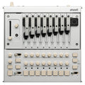 Top view of a silver Korg Phase-8 synthesizer with nine metal keys and multiple knobs, buttons, and sliders.