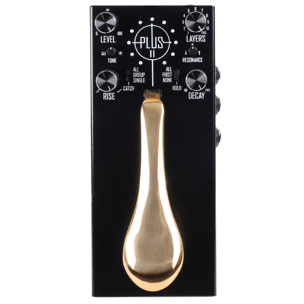 Black effects pedal with gold piano-style sustain pedal and multiple control knobs and switches.