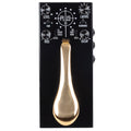 Black effects pedal with gold piano-style sustain pedal and multiple control knobs and switches.