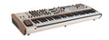 Beige analog synthesizer with wooden side panels, multiple knobs and pads, and a 37-key keyboard.