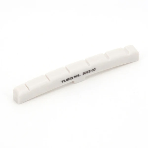 White slotted curved guitar nut with the text 'TUSQ XL 5072-00' printed on it.