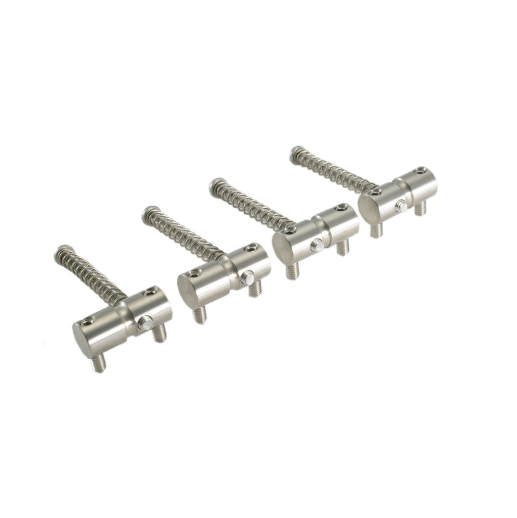 Five silver metal spring-loaded saddles with adjustment screws on a white background.