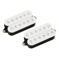 Two white humbucker guitar pickups with visible screw pole pieces and Fishman branding on each pickup.