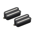 Two black guitar pickups with white bars and metal mounting rings on a white background.
