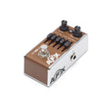 Brown and silver guitar effects pedal with knobs, sliders, a footswitch, and a 1/4 inch input jack