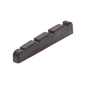 Black plastic guitar or bass string nut with four string slots and model number engraved.