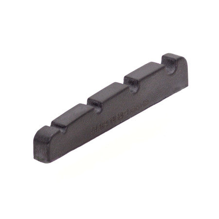 Black plastic guitar or bass string nut with four string slots and model number engraved.