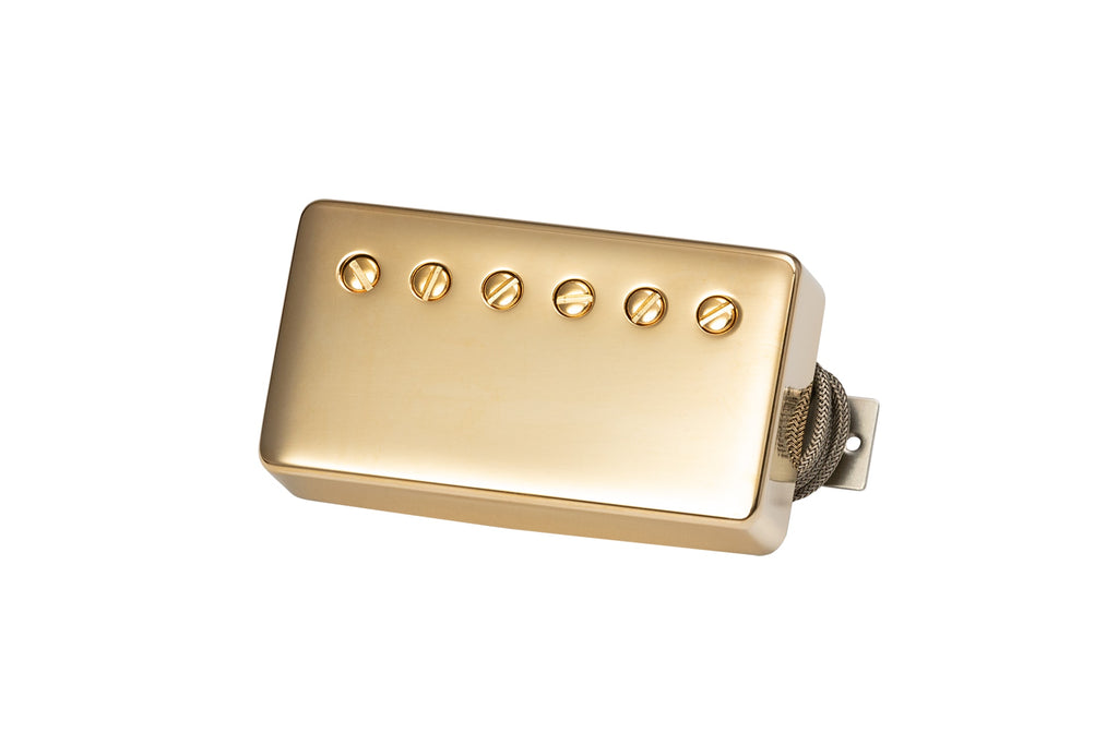 Gold-colored rectangular guitar pickup with six adjustment screws and a braided wire lead.