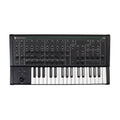 Black synthesizer keyboard with multiple knobs, buttons, keys, and patchable 1/4 inch jacks on top panel.