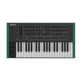 Top view of a black and green synthesizer keyboard with multiple knobs, buttons, and a pitch/modulation wheel.