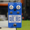 Blue guitar pedal with two white knobs labeled Depth and Pres, two toggle switches, and a footswitch.