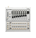Top view of a silver control panel with eight sliding controls labeled with musical notes and various knobs, buttons, and switches.
