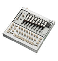 Silver electronic device with eight metal keys, multiple knobs, switches, and buttons arranged on its surface.