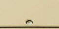Close-up view of a cream and black layered plastic pickguard blank for guitar.