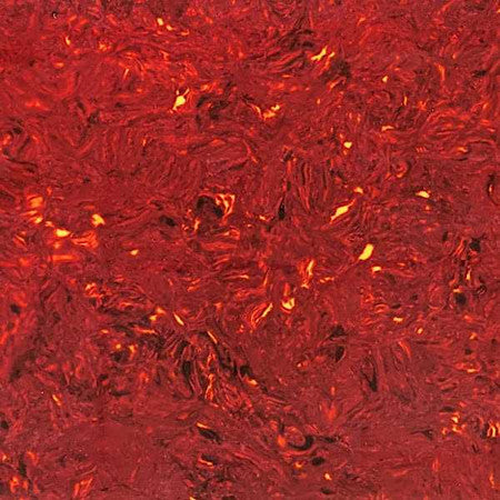 Close-up image of a red vintage tortoise patterned material with a swirling design texture.