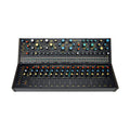 Black modular synthesizer with multiple knobs, buttons, jack connectors, and touch pads in two tiers.