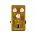 Gold-colored effects pedal with three white knobs, one footswitch, and tribal-style black graphics.