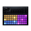 Black polyphonic synthesizer with illuminated colorful pad grid and multiple knobs and buttons