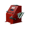 Red metal pickup coil winding machine with control knob, buttons, toggle switch, and shaft for mounting pickups.