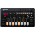Top view of a black Roland J-6 synthesizer with buttons, knobs, digital display, and audio jacks.