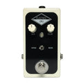 Rectangular guitar effects pedal with two control knobs, a toggle switch, and a footswitch on a white and black panel.