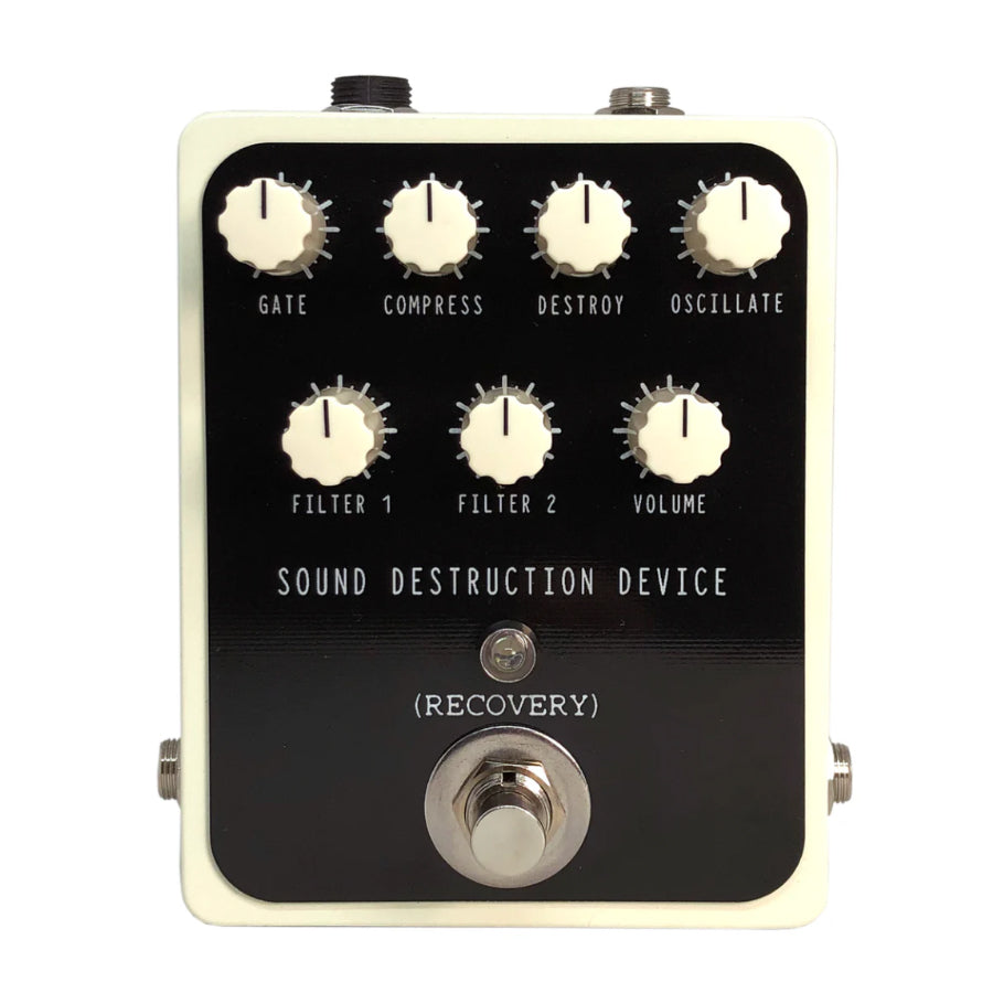 White and black guitar effects pedal with seven control knobs and one footswitch labeled Sound Destruction Device (Recovery).
